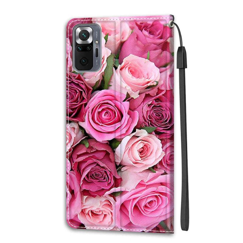 Fliptok / Bőrtok Xiaomi Redmi Note 10 Pro szíjjal Strap Roses