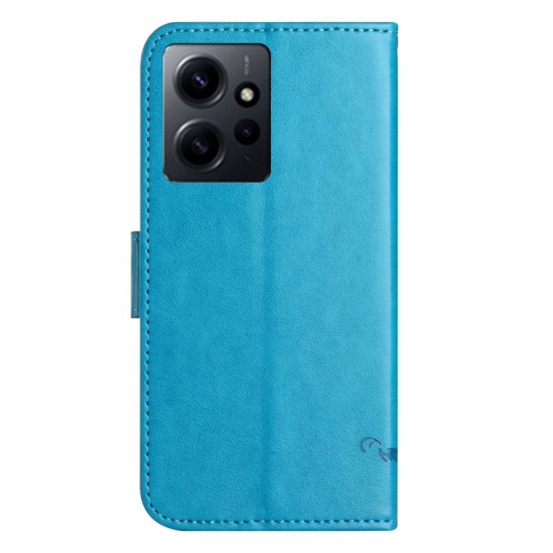 Fliptok / Bőrtok Xiaomi Redmi Note 12 4G szíjjal Virágok És Pillangók Pánttal