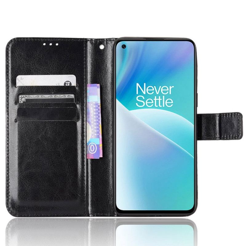 Fliptok / Bőrtok OnePlus Nord 2T 5G szíjjal Fényes Műbőr Pánttal