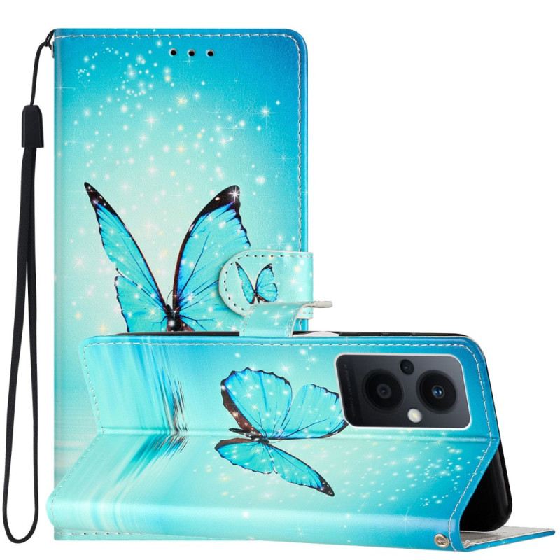 Fliptok / Bőrtok Oppo Reno 8 Lite szíjjal Kék Pillangók Pánttal